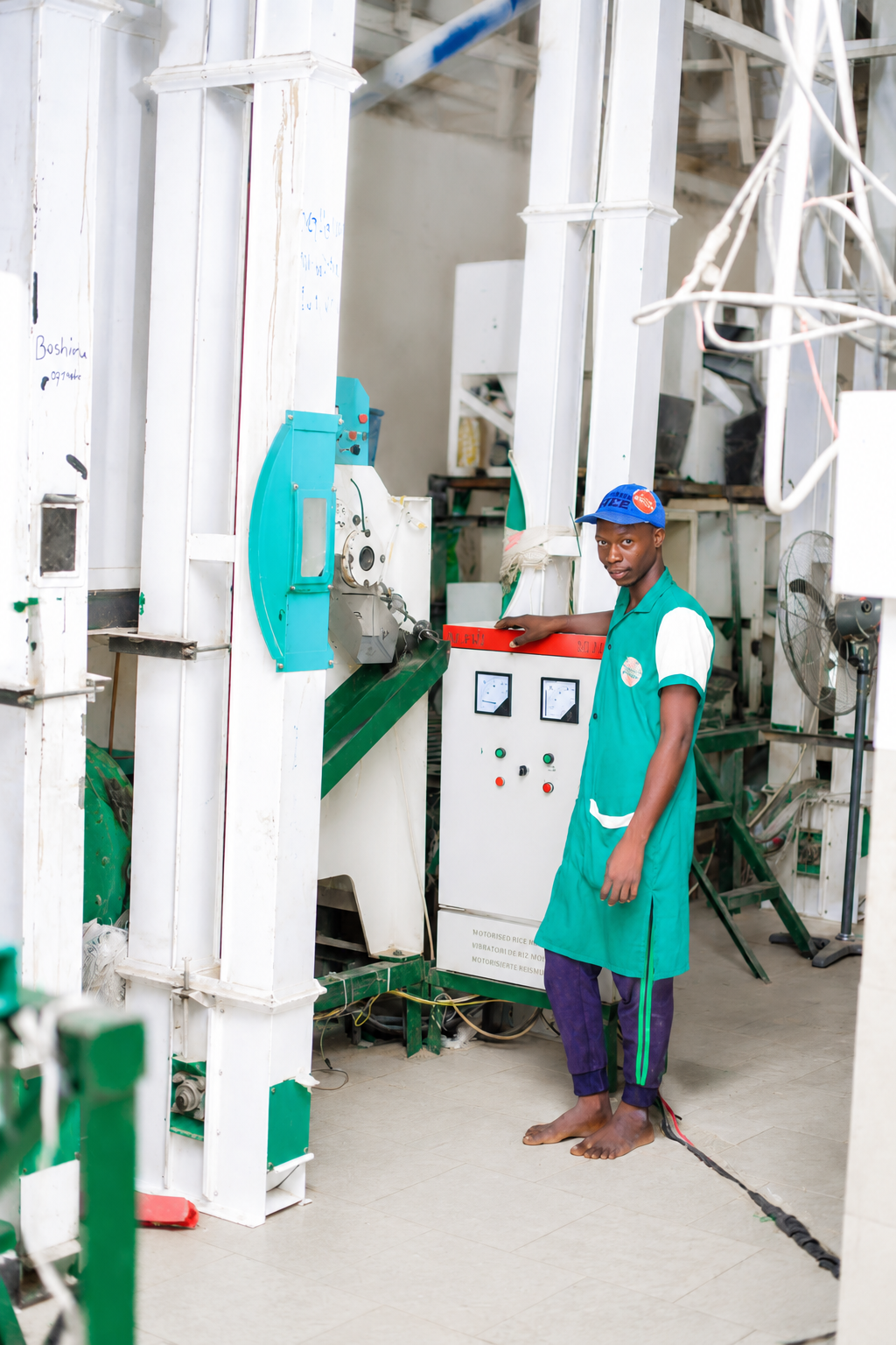 An ACAS Farm operator overseeing the milling line at the Rice Processing Plant in Gombe State