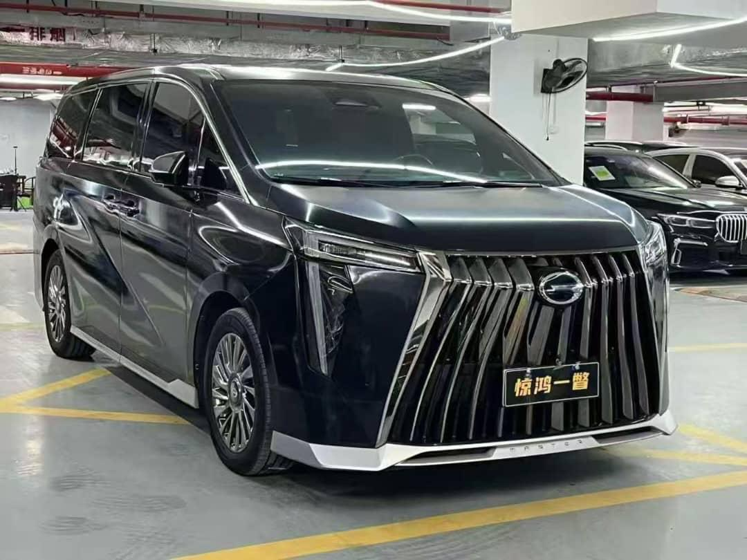 Black luxury MPV, front three-quarter view